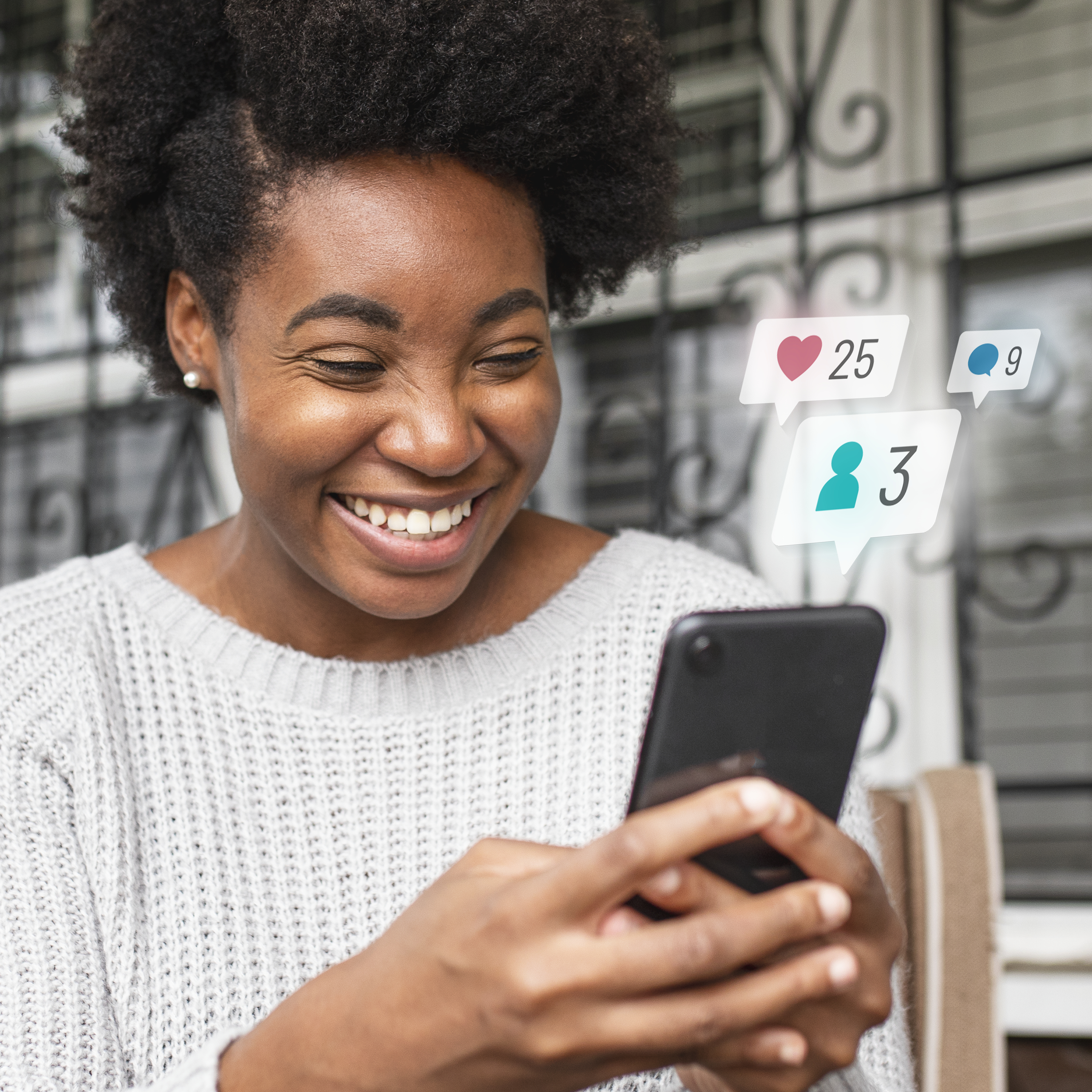african american woman checking social media on a phone